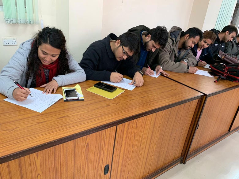 kids care everywhere secondary nepal row of students blog image