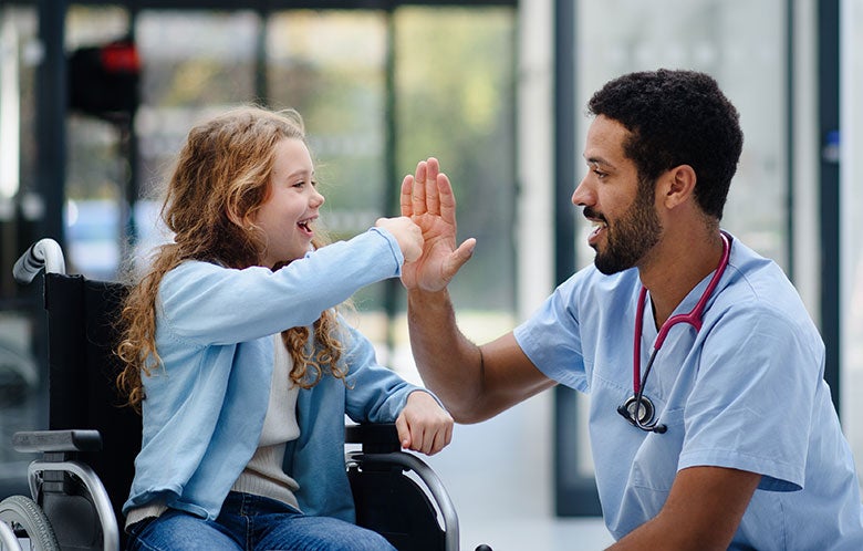 nurses month nurse with child in wheelchair blog image    