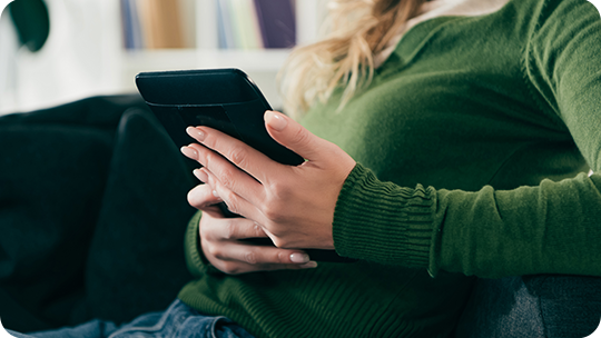 woman holding ebook close up landing page image    